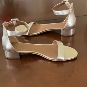 Elegant gold Sandals low heel NWOT never worn pristine condition